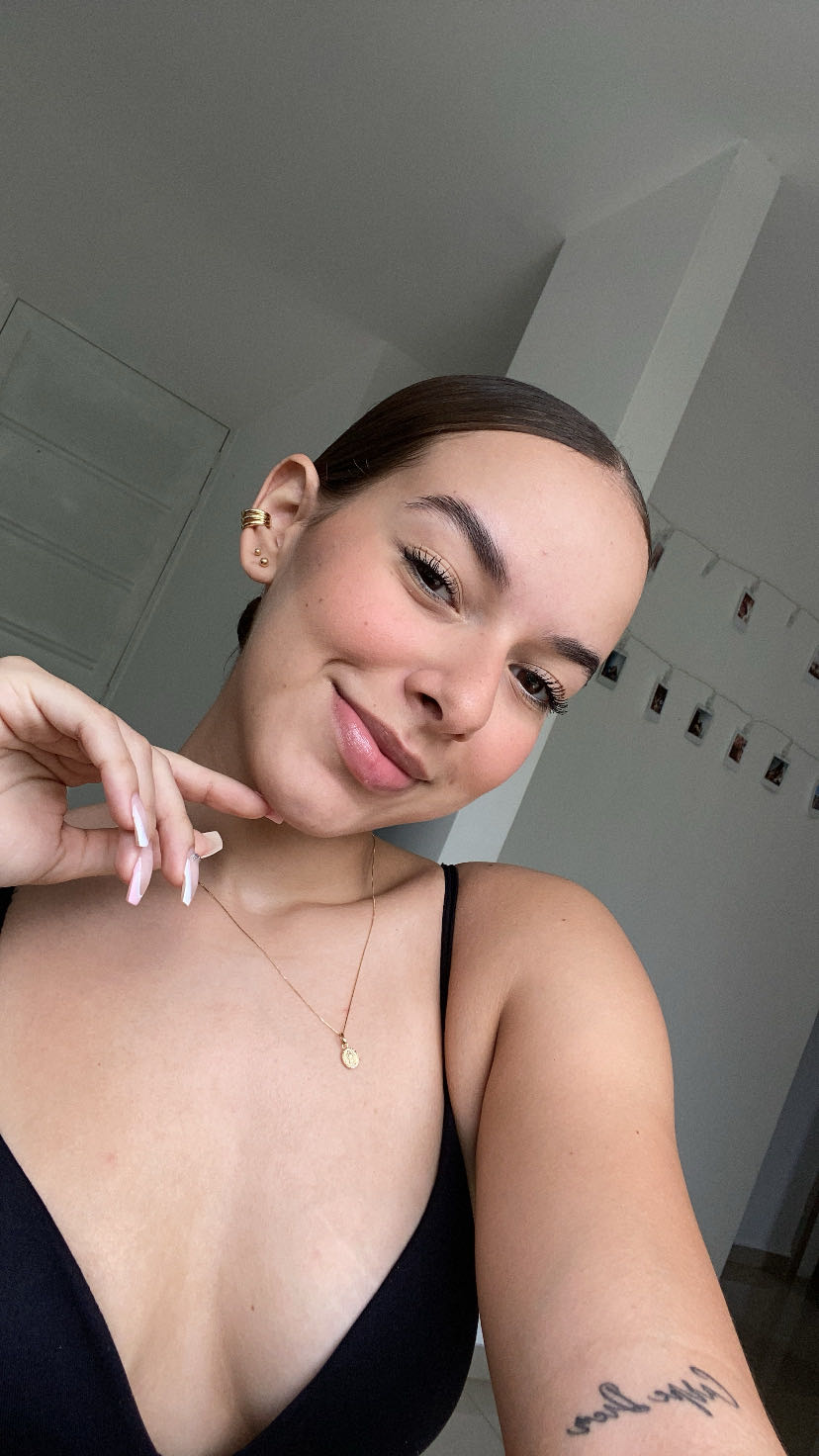 April Smith, an adult member from Colombia, smiling towards the camera