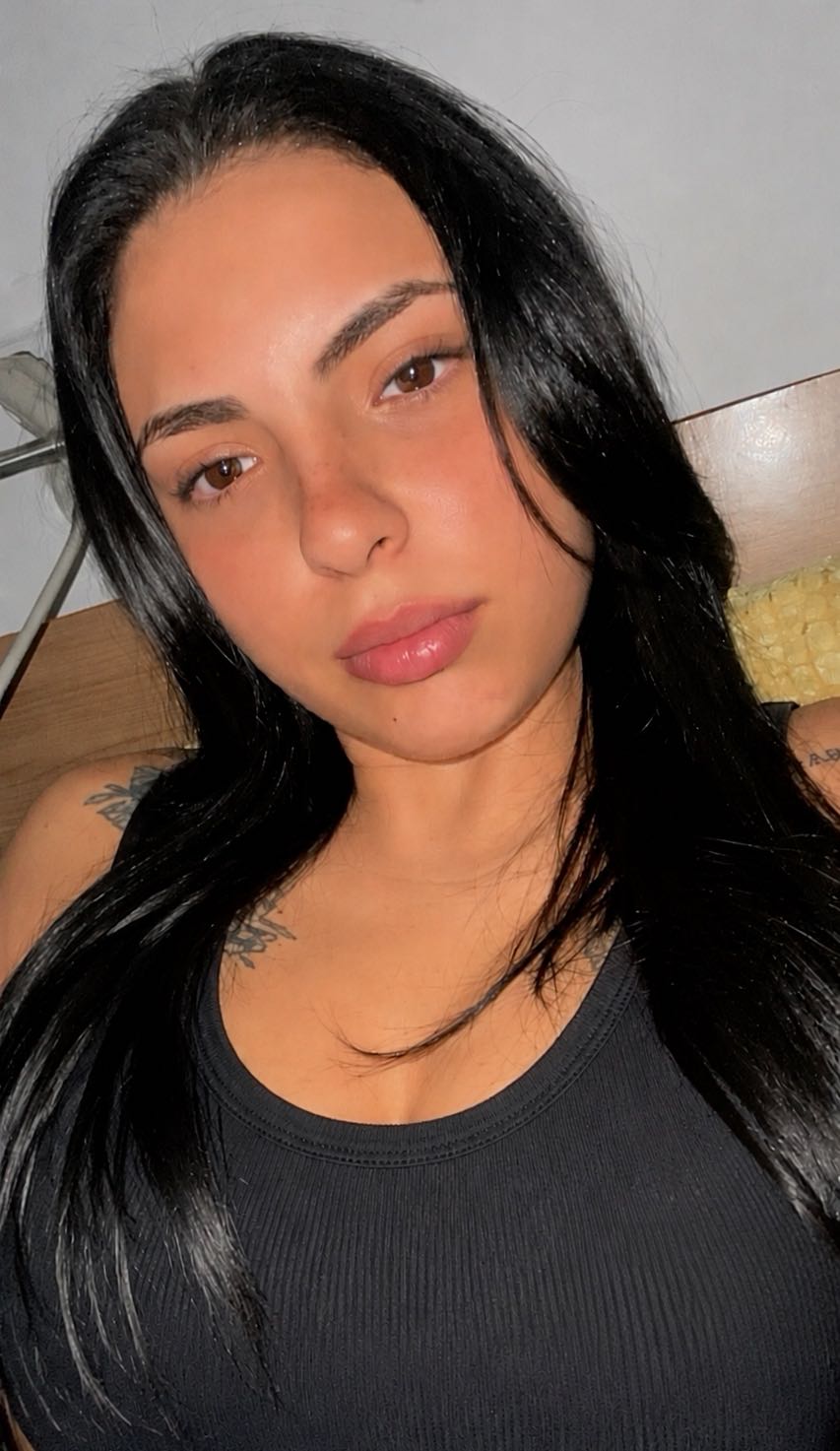 Valentina, an adult member from Spain, in warm indoor light