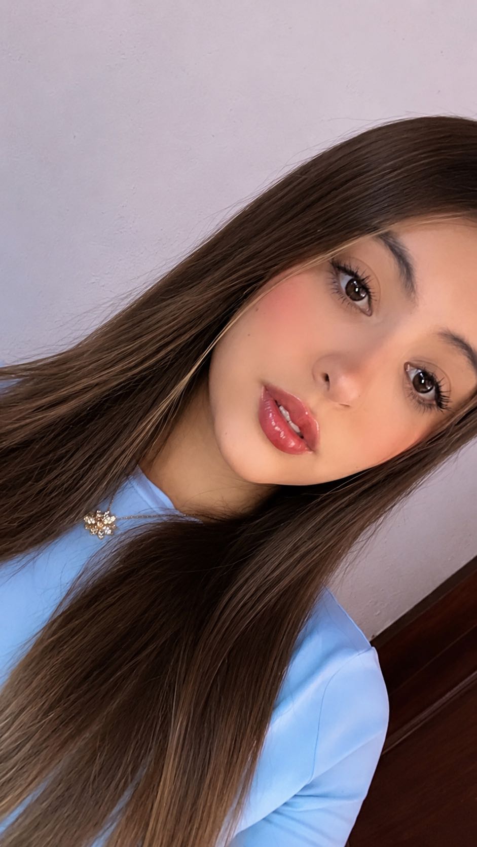 Fany, an adult member from Mexico, in warm indoor light