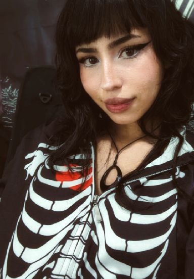 Lizz, an adult member from Colombia, with a warm smile