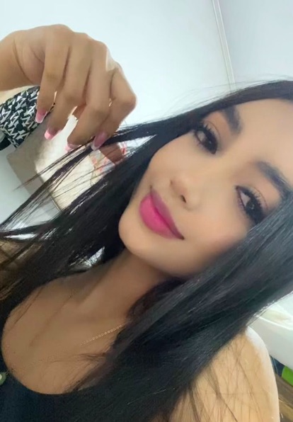 Cata, an adult member from Colombia, smiling at the camera