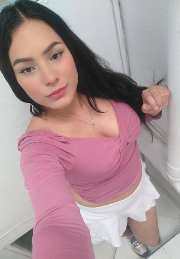 Maria, an adult member from Colombia, smiling towards the camera