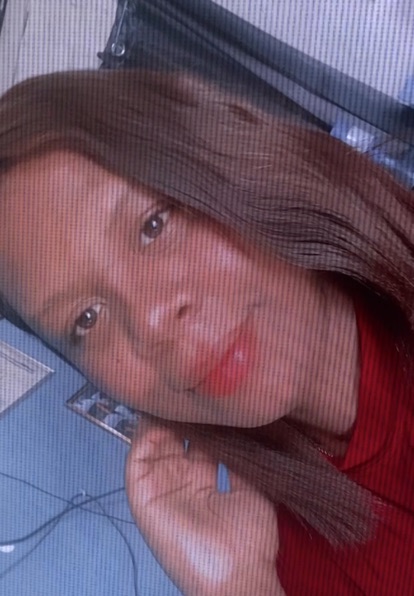 Lucero, an adult member from the United States, facing the camera